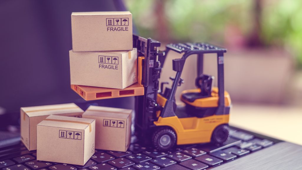 A photoillustration depicts a toy forklift moving a stack of toy boxes into place