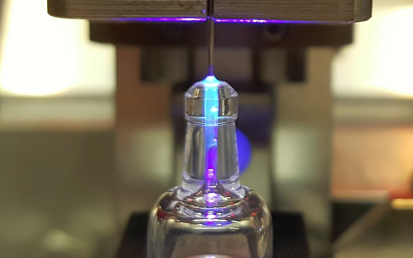 LED UV curing of adhesive for syringe assembly