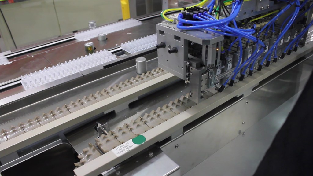Automated picking and placing of glass tubes into trays