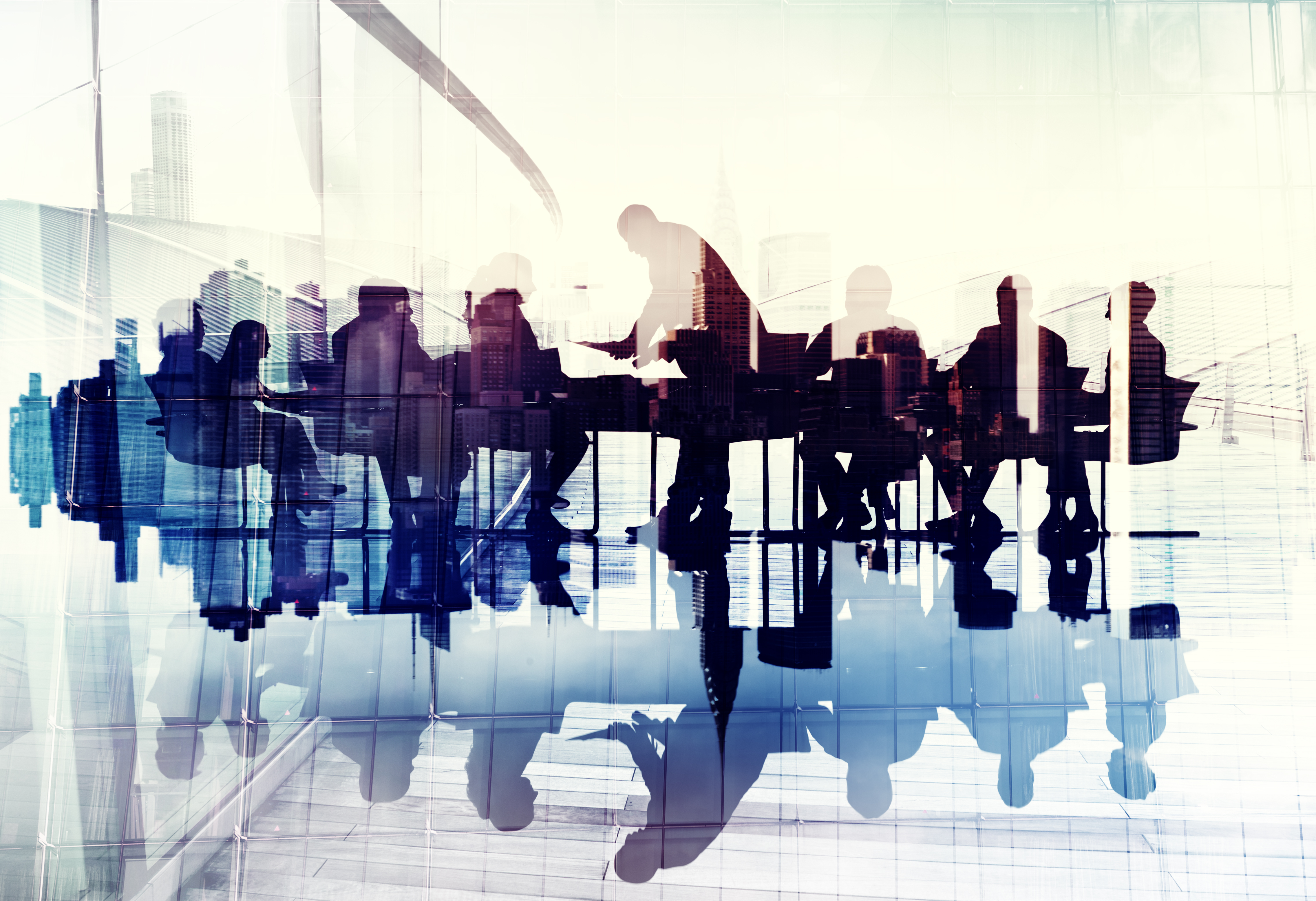 Abstract image of business people's silhouettes in a meeting