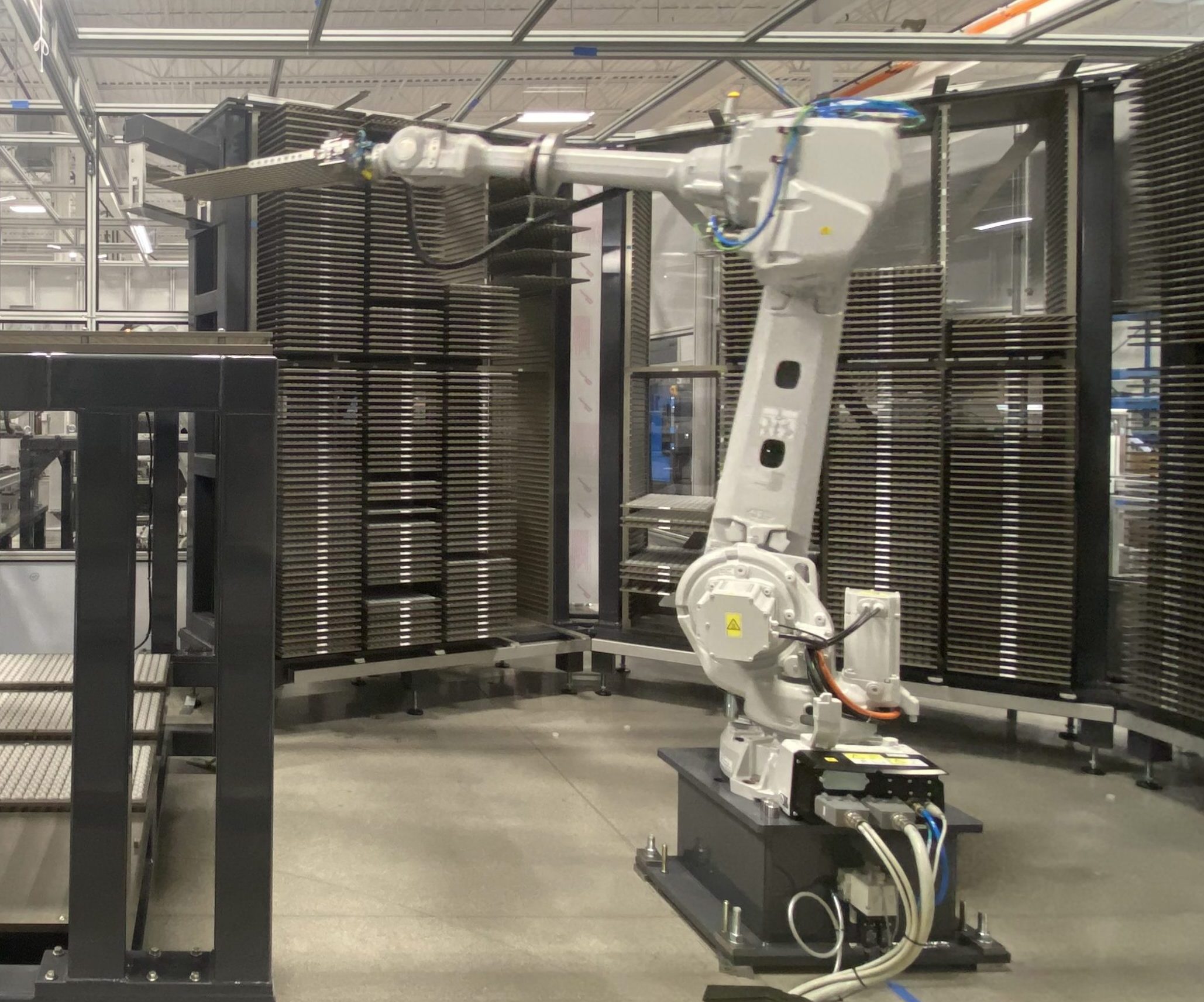 Robot used to move trays of components
