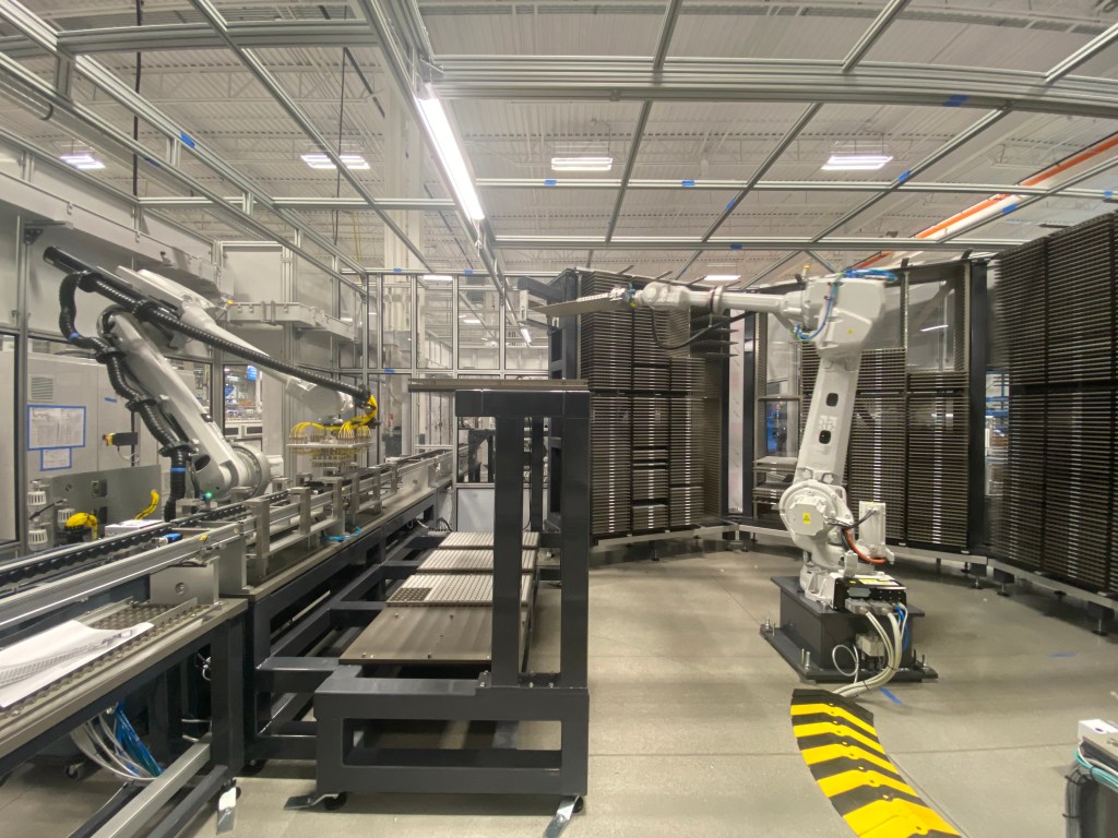 Robots used to move trays of components