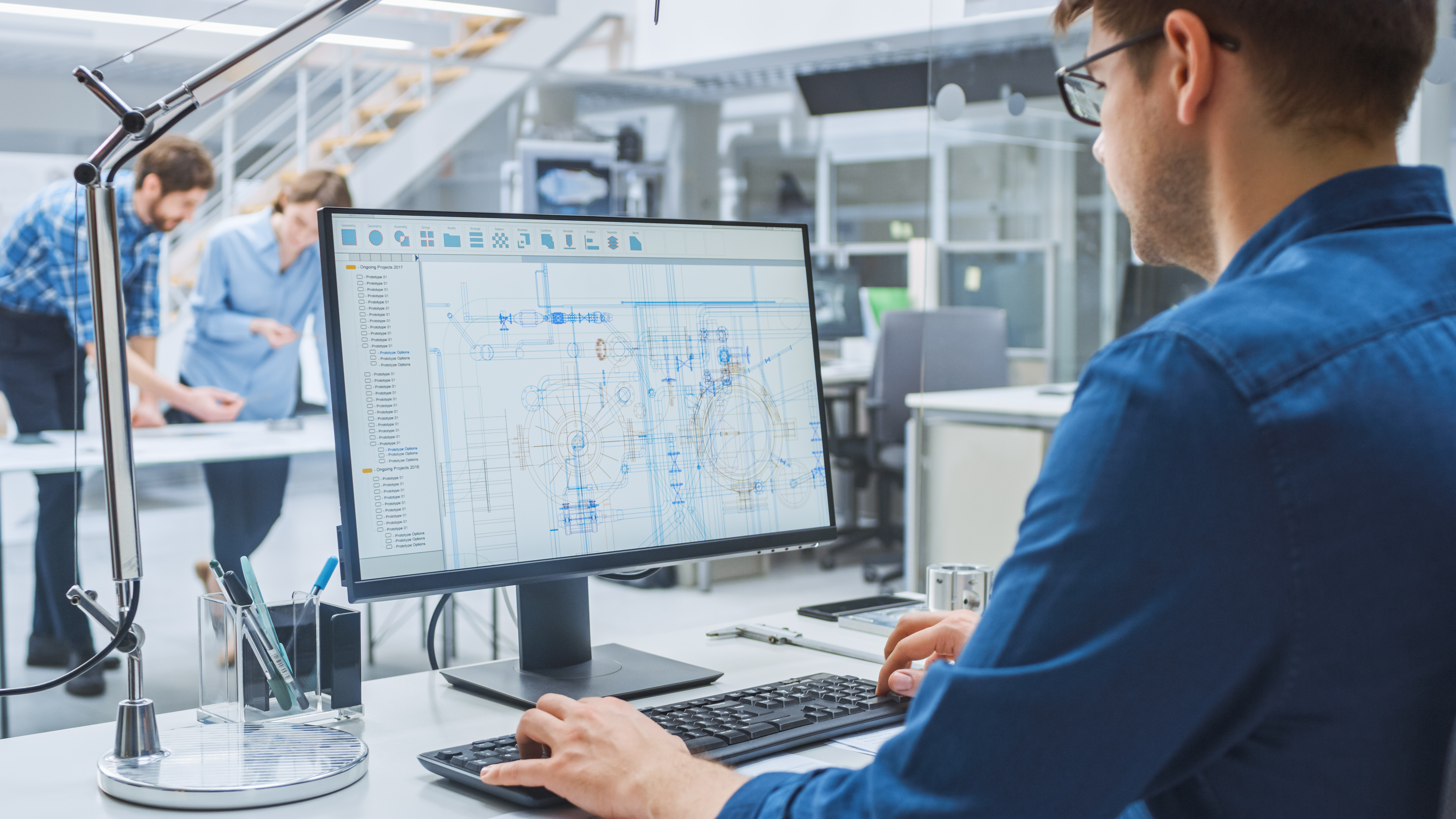 Over,The,Shoulder,Shot,Of,Engineer,Working,With,Cad,Software